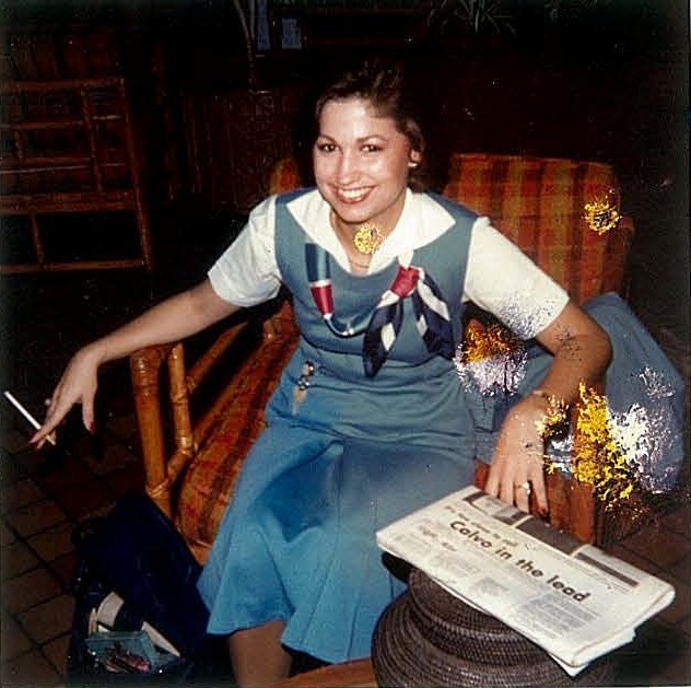 1970s Pan Am flight attendant Sarah McPale relaxes in the lobby of the Guam Hilton prior to crew pick up for flight 842 to Honolulu.